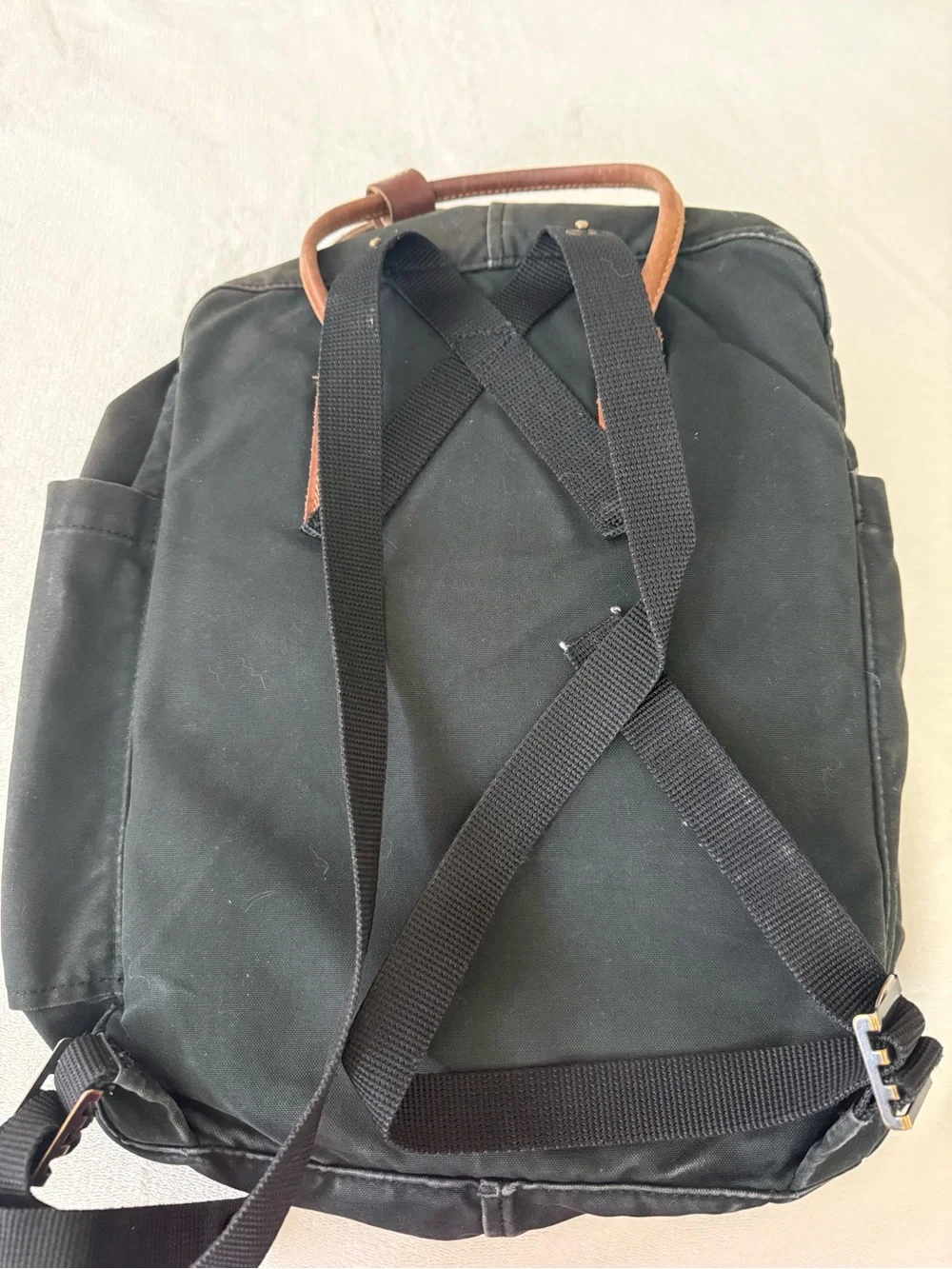 Fjallraven Kanken Canvas Backpack in Black with Brown Leather Accents